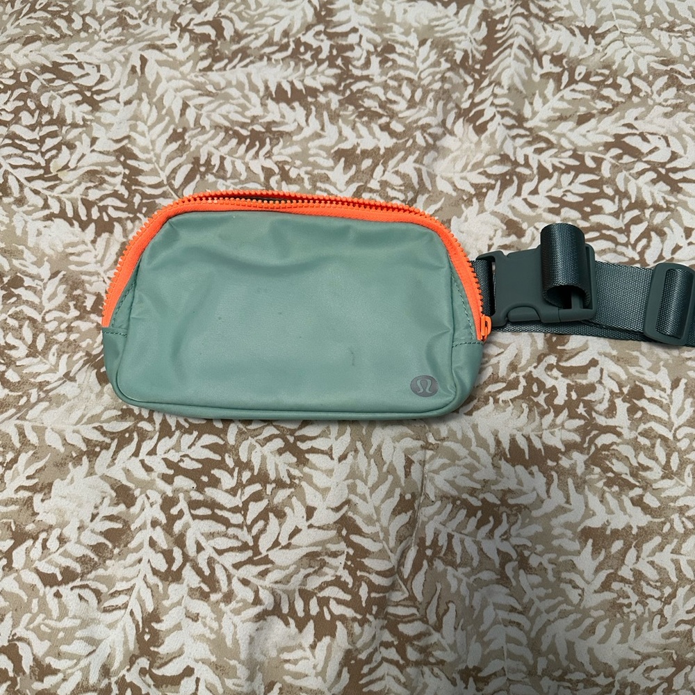 Lululemon everywhere belt bag in teal and neon orange